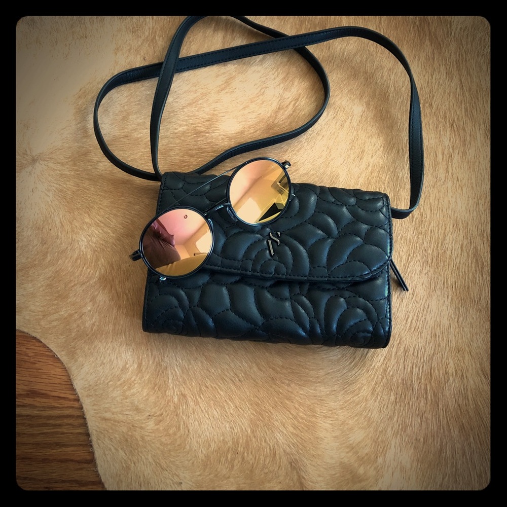Black strap bag and sunglasses